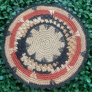 Antique western primitive looking straw circular striped multicolor trivet